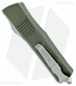 Microtech Combat Troodon T/E Automatic OTF Knife OD Green (3.8" Stonewash) 8 Microtech Combat Troodon T/E Automatic OTF Knife OD Green (3.8" Stonewash) -Avokelavavat Sales Store Microtech Combat Troodon TE OD Green SW 144 10OD BHQ 98151 jr side